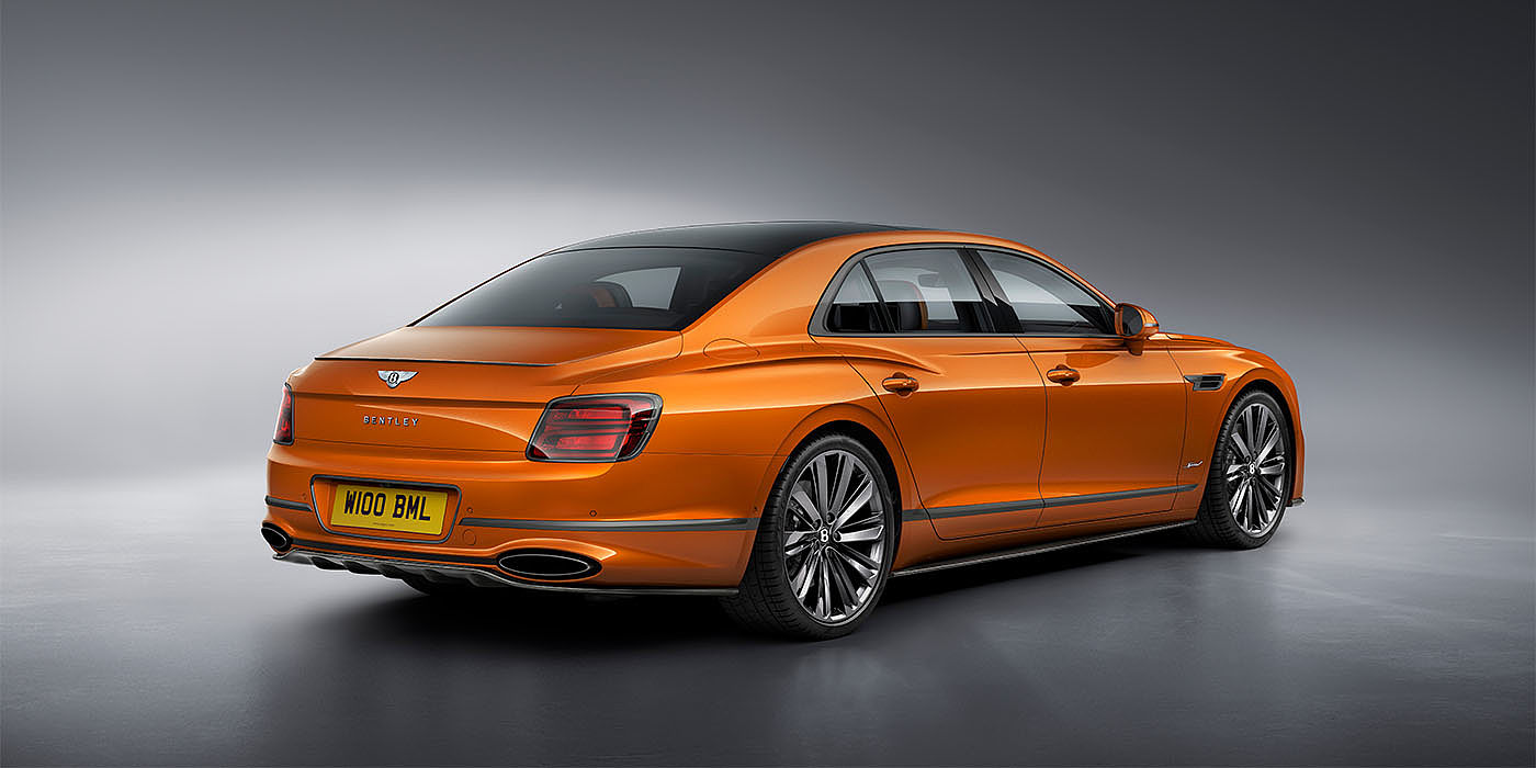 Bentley Kaohsiung Bentley Flying Spur Speed in Orange Flame colour rear view, featuring Bentley insignia and enhanced exhaust muffler.
