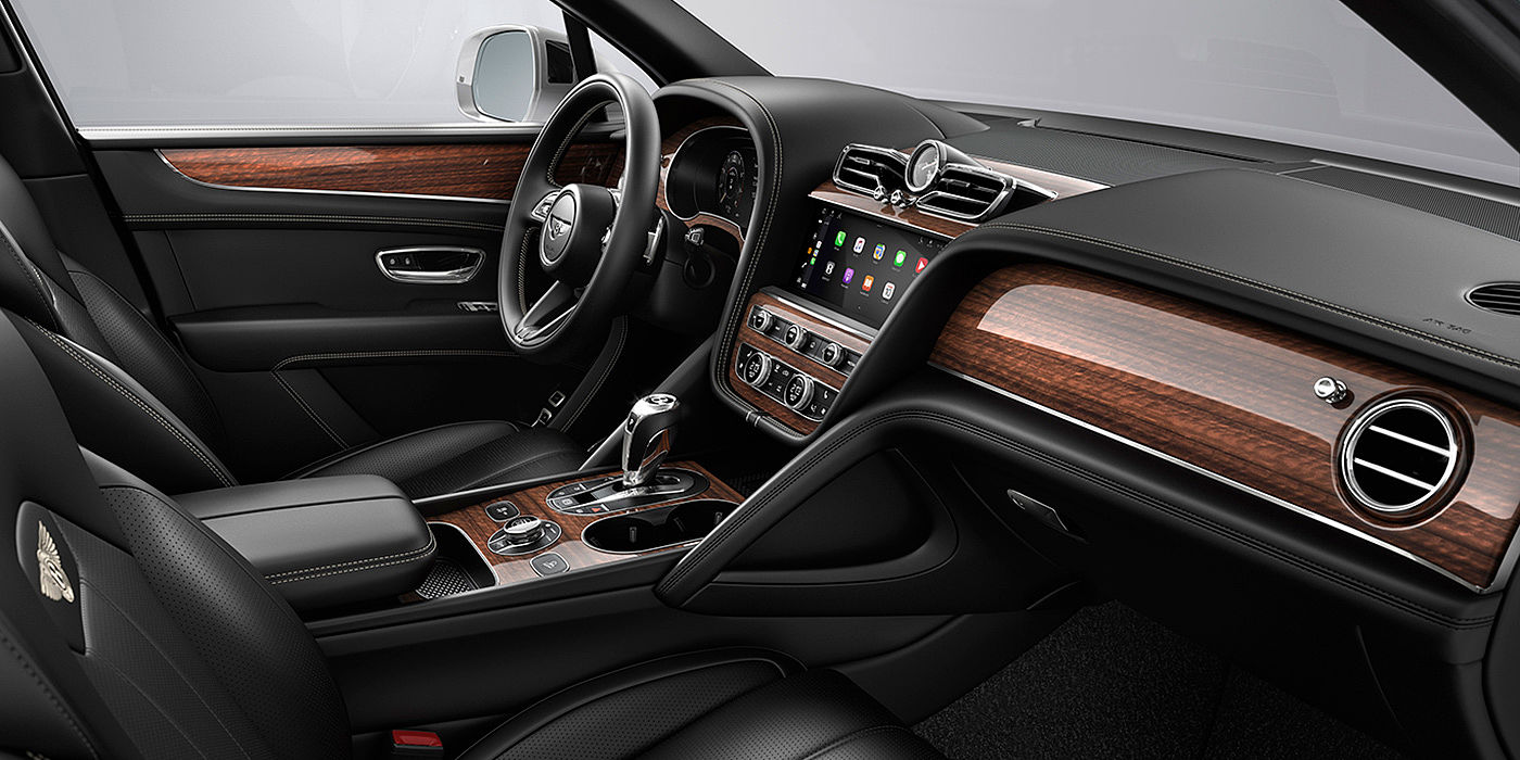 Bentley Kaohsiung Bentley Bentayga interior with a Crown Cut Walnut veneer, view from the passenger seat over looking the driver's seat.