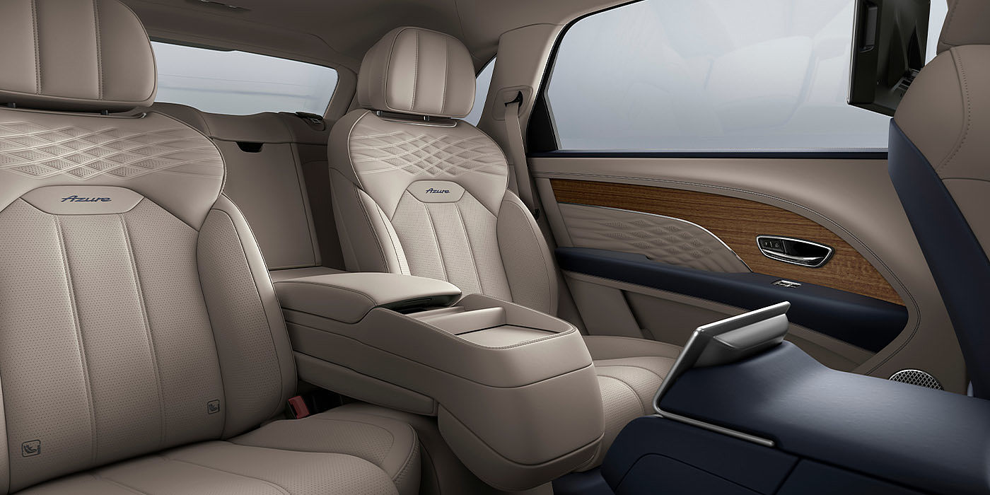 Bentley Kaohsiung Bentley Bentayga EWB Azure interior view for rear passengers with Portland hide featuring Azure Emblem in Imperial Blue contrast stitch.