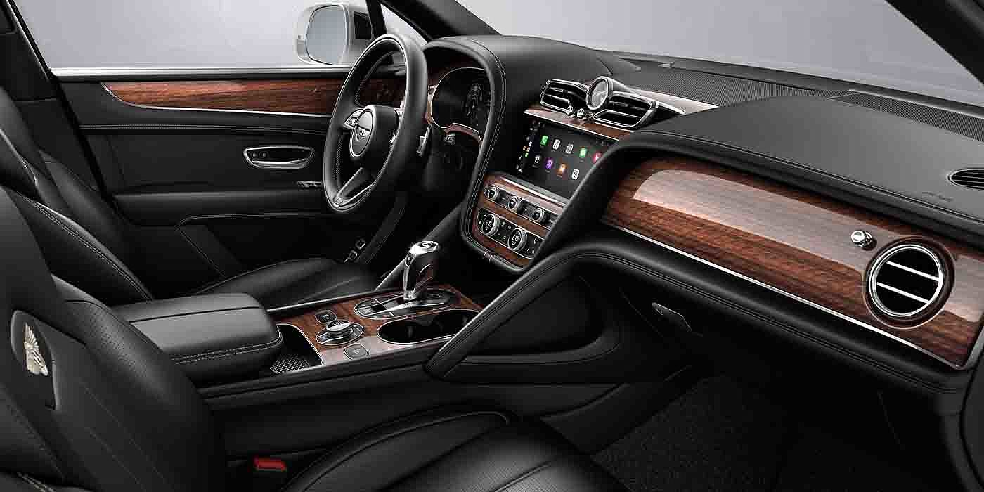 Bentley Kaohsiung Bentley Bentayga EWB interior with a Crown Cut Walnut veneer, view from the passenger seat over looking the driver's seat.