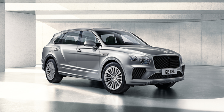 Bentley Kaohsiung Bentley Bentayga Extended Wheelbase SUV front three quarter in Moonbeam paint with a grey background