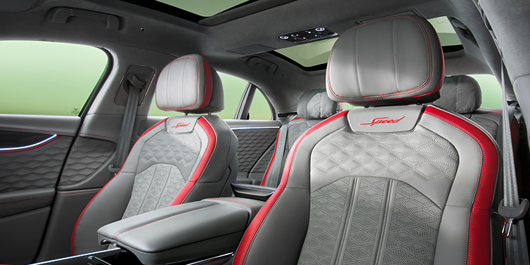 Bentley Kaohsiung Bentley Flying Spur Speed sedan interior showing front and rear seats in Hotspur red and Gravity Grey hides, with Speed seat emblems