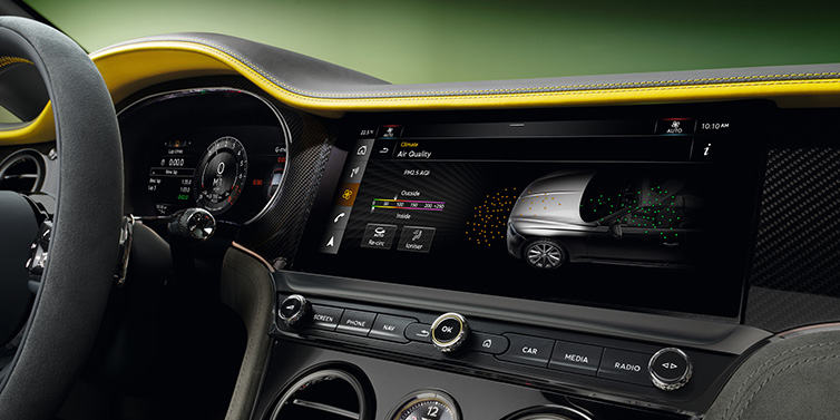 Bentley Kaohsiung Bentley Continental GTC Speed convertible front interior centre console with MMI screen showing Air Quality visualisation surrounded by Cyber Yellow by Mulliner and Gravity Grey hides and high gloss carbon fibre veneer