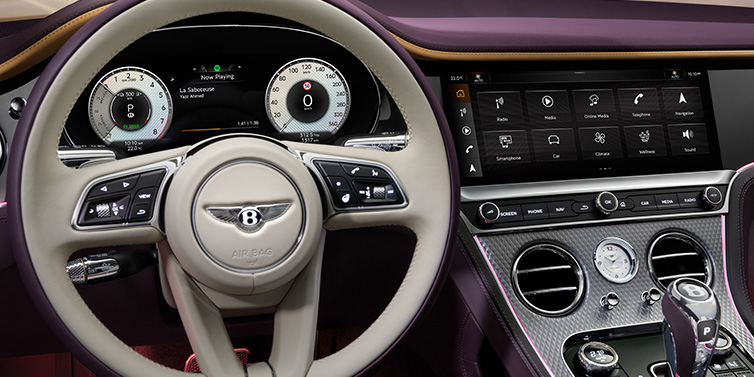 Bentley Kaohsiung Bentley Continental GTC Mulliner convertible steering wheel and drivers screens surrounded by Damson purple and Linen hides